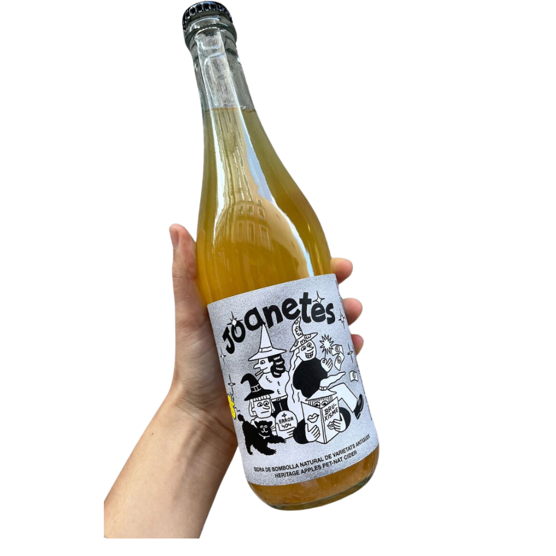 La Producteria holding bottle of natural orange wine